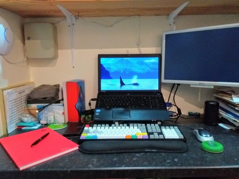 My ad hoc desk, also showing my Waterman Carène (left), WASD v3 mechanical keyboard and an Anker Nebula projector / speaker.