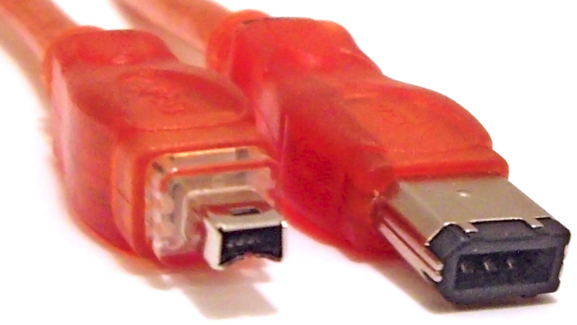 A red cable with a mini DV (4 pin FireWire) connector at one end and the larger 6 pin connector at the other.