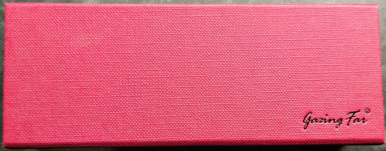 A red textured box with the words "Gazing Far" embossed in the bottom right corner.