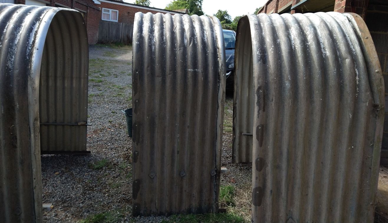 Photograph showing three arched pieces of metal - the three sections of the hut.