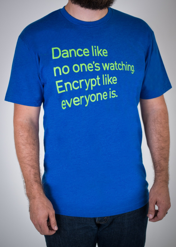 Man wearing a blue t-shirt with green text: "Dance like no one's watching.  Encrypt like everyone is."