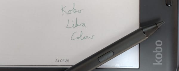 Photograph of my Kobo Stylus 2 resting on my Kobo Libra Colour.  A writing sample says "Kobo Libra Colour" in green.